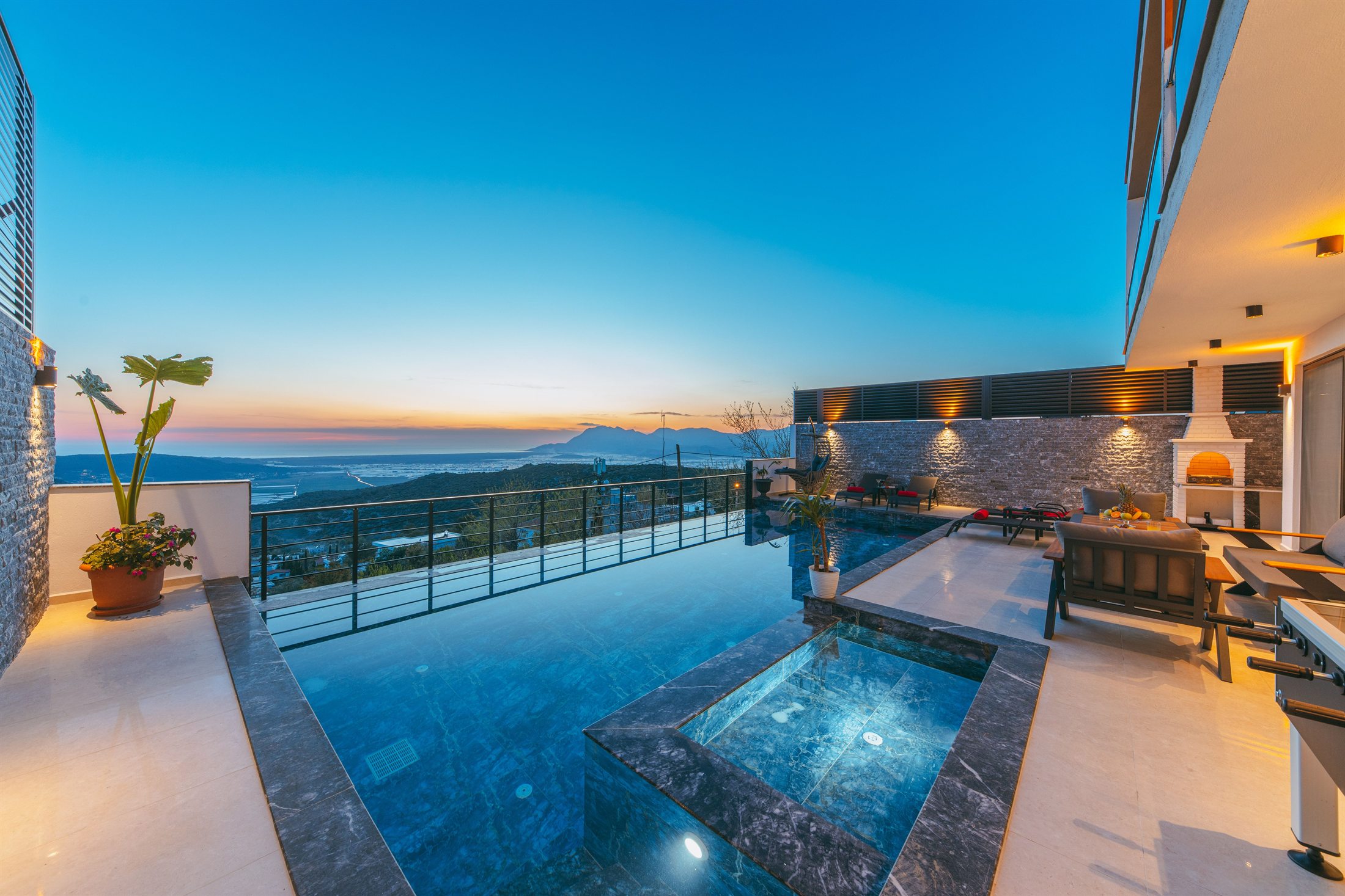 Pool terrace overlooking the Adriatic at sunset