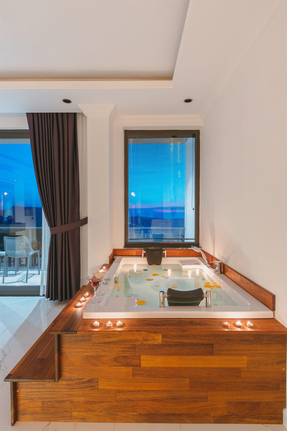 Freestanding bath with timber surround and Adriatic view