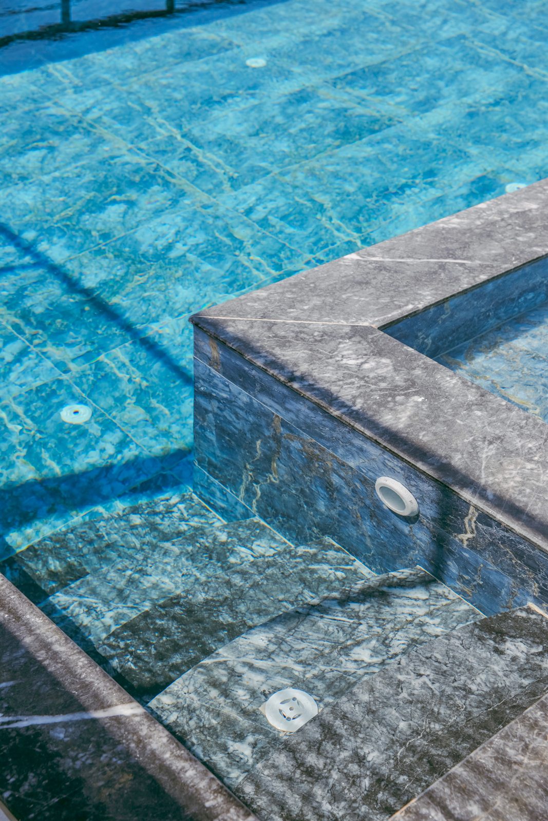 Close view of the infinity pool edge and stone detail